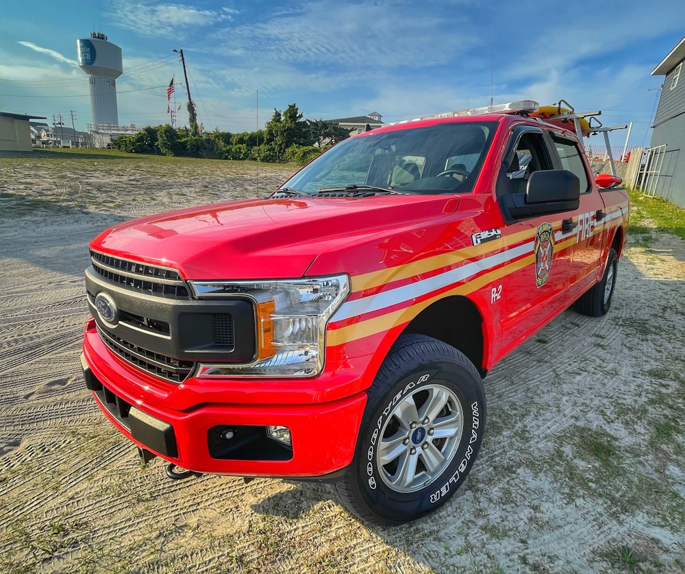 red chevrolet crew cab pickup truck