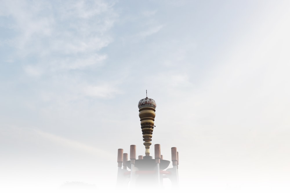 brown and white tower under white sky