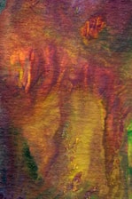 Close-up of a richly textured abstract painting with warm neutral tones.