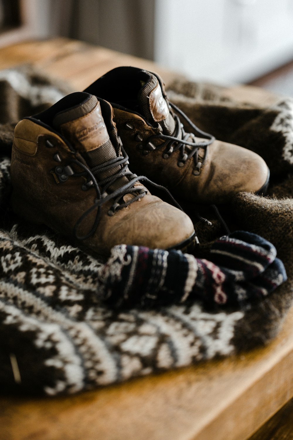 person wearing brown leather work boots