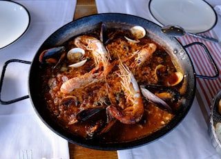 cooked shrimp on black round plate