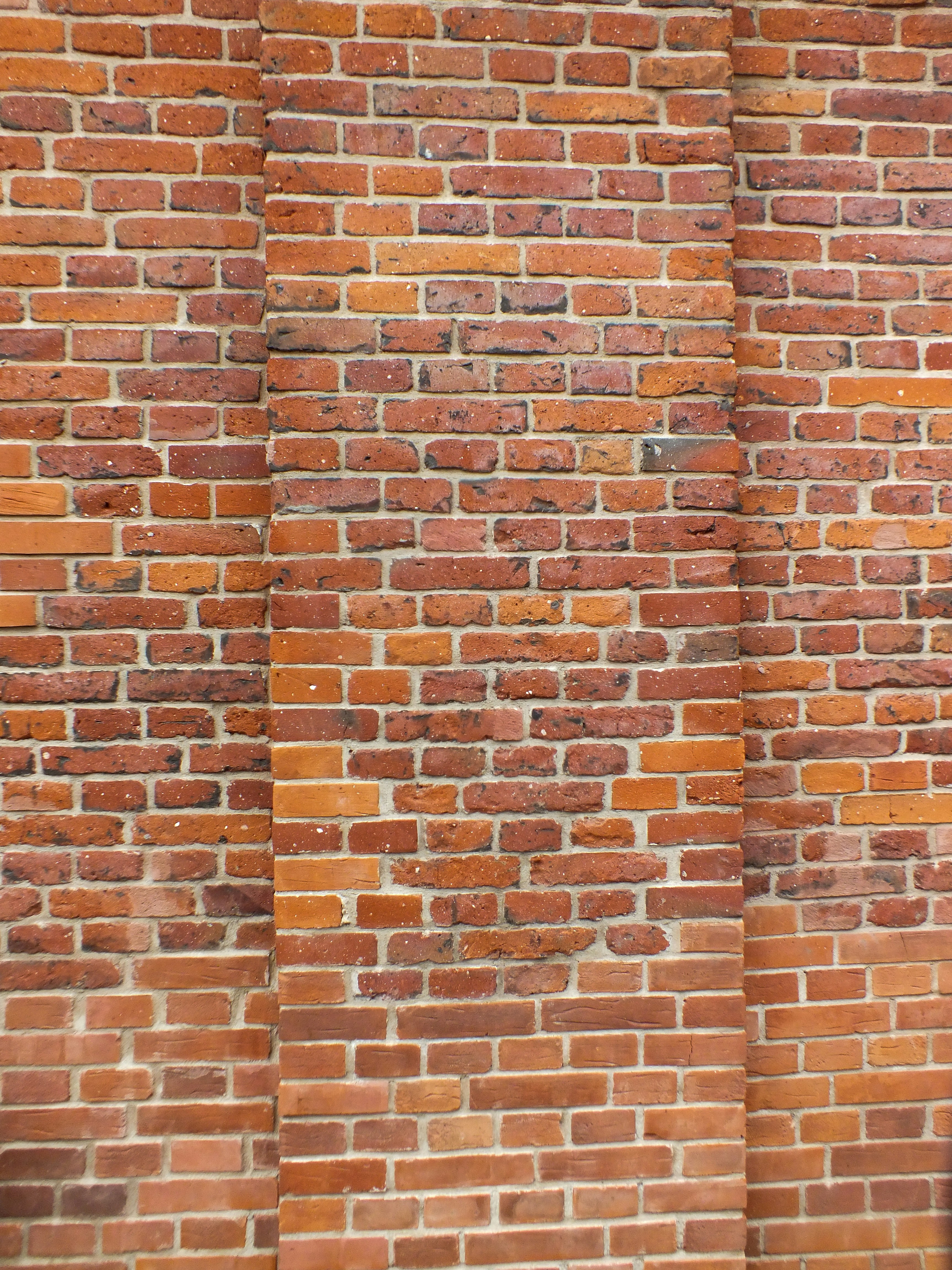 brown brick wall during daytime