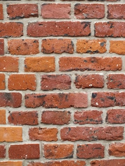 Close-up of textured bricks in different colors.