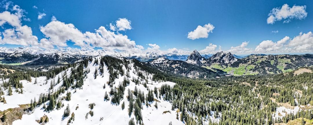 snow covered mountain under blue sky during daytime