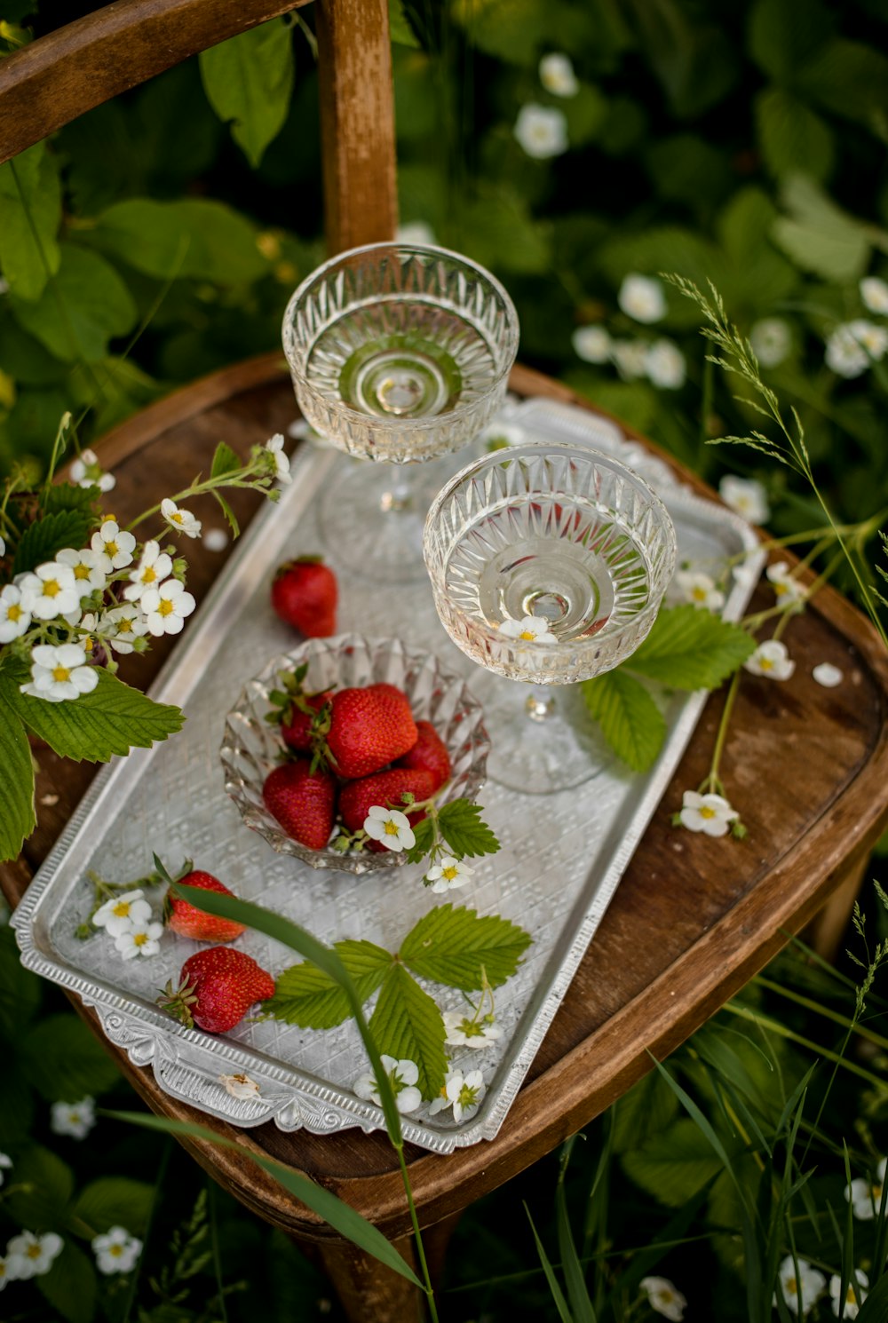 red strawberries on white ceramic bowl