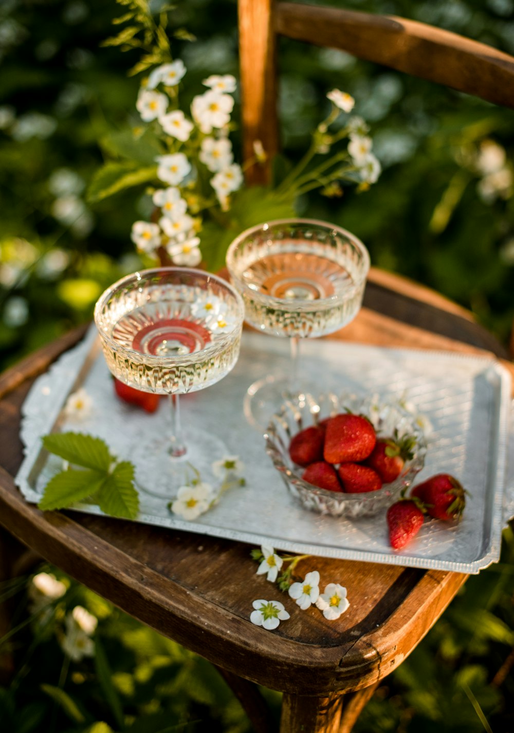 red strawberries in clear glass bowl