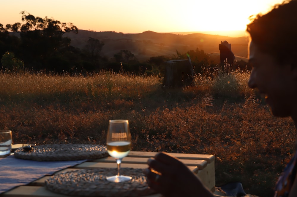 clear wine glass on brown wooden table