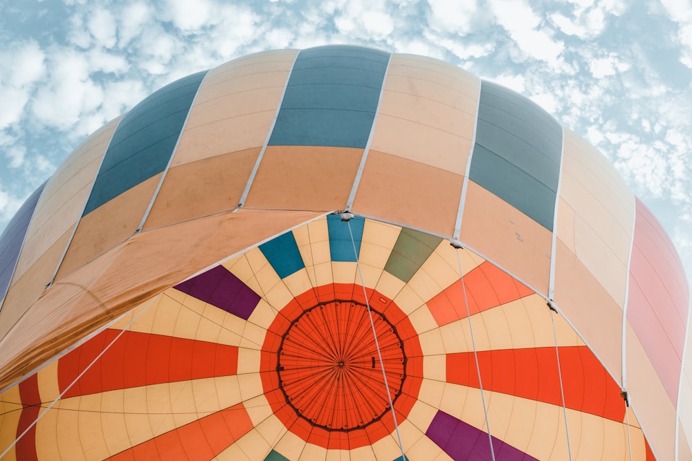 red yellow and white hot air balloon under blue sky during daytime