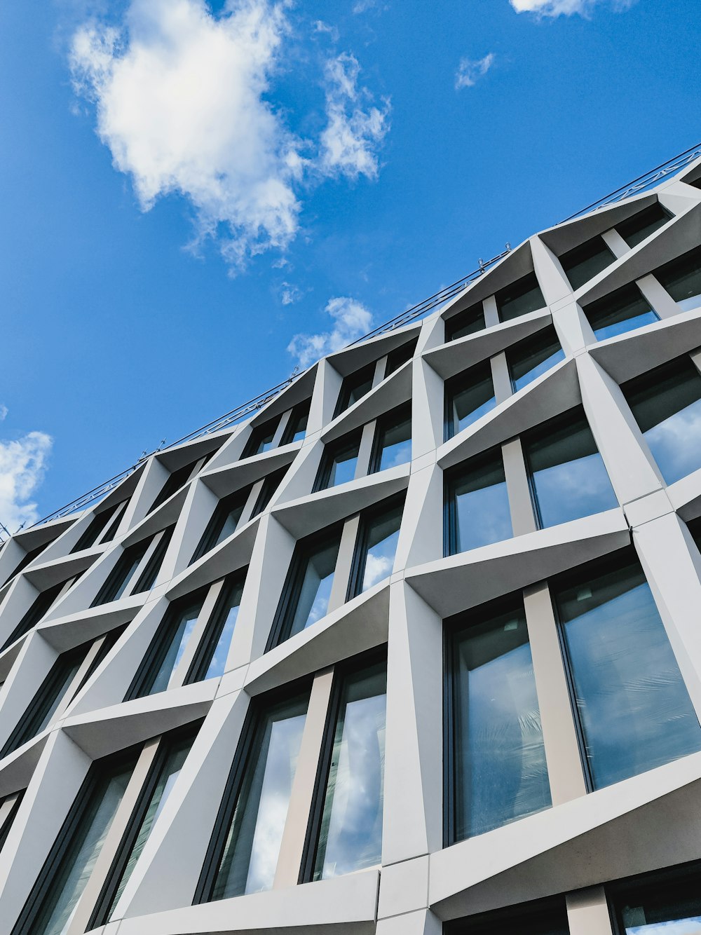 white concrete building under blue sky during daytime