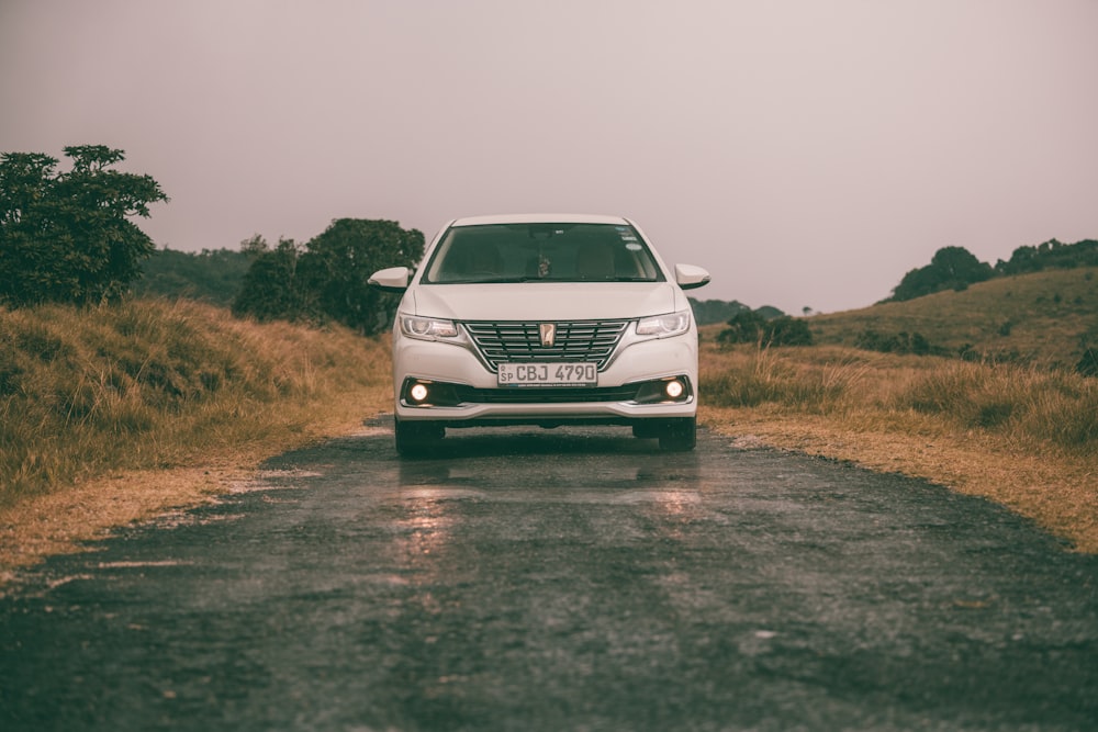 white volkswagen car on brown field during daytime