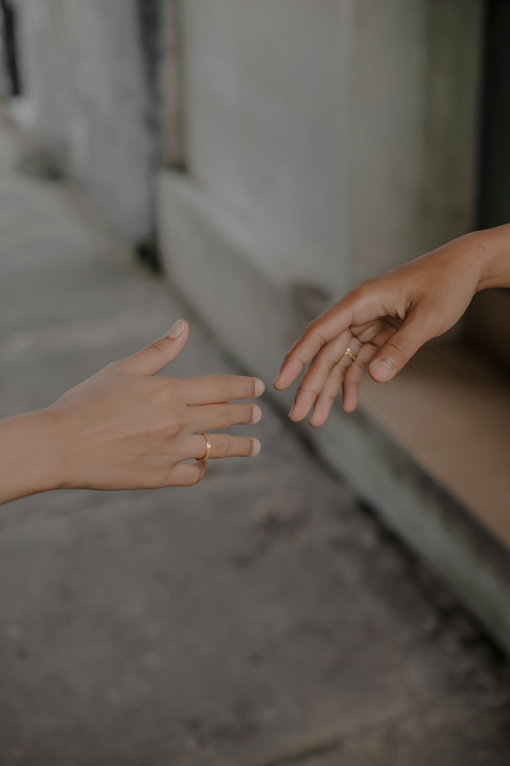 persons hand on gray concrete floor