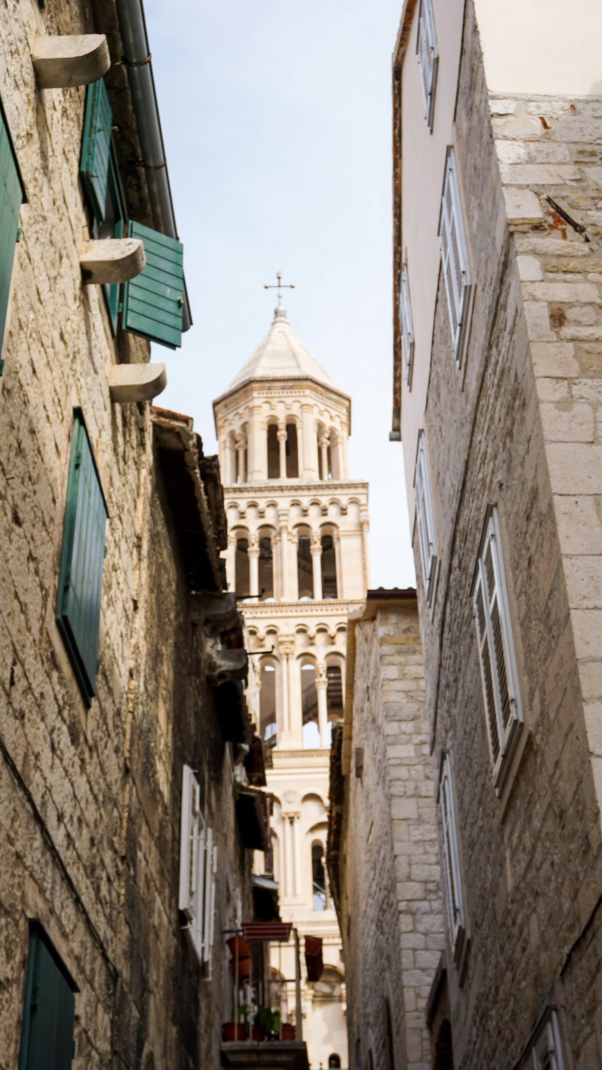 Split old-town alley framing the Cathedral of Saint Domnius bell tower