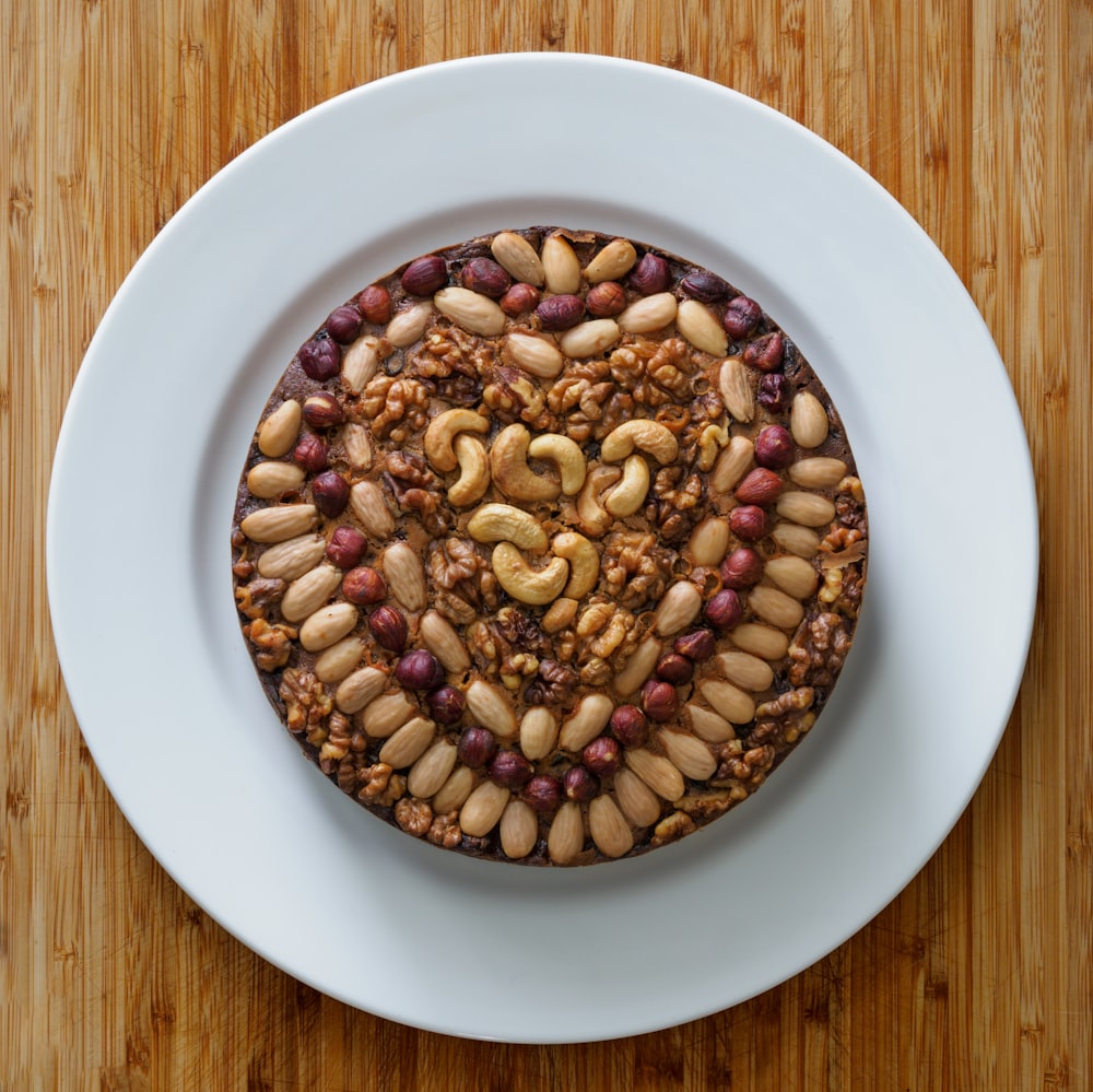 brown and white beans on white ceramic plate