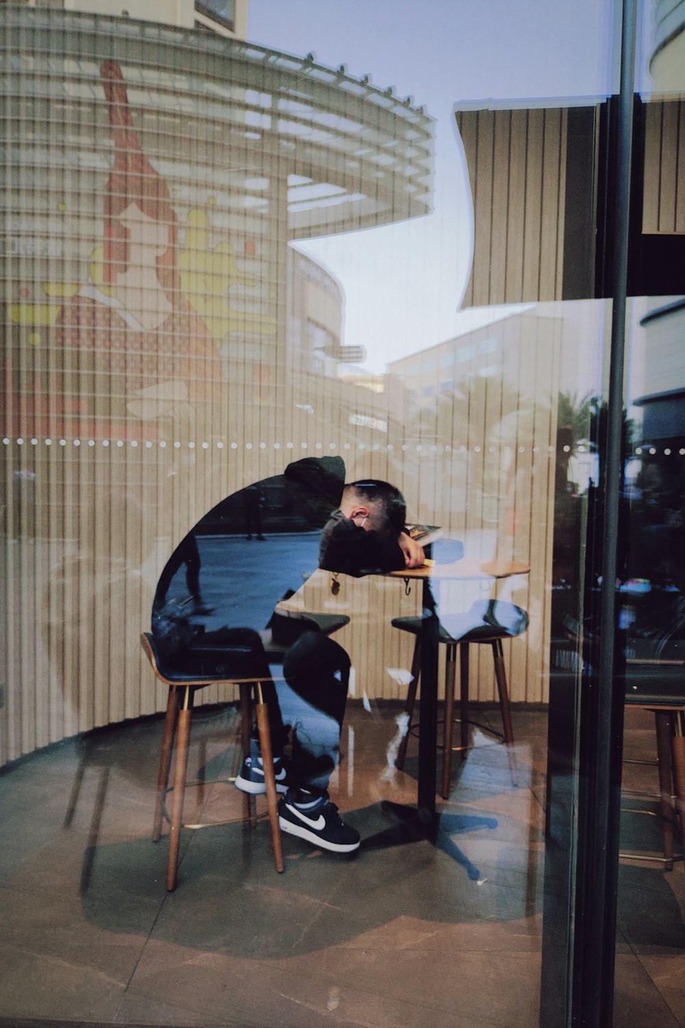 man in black jacket sitting on chair