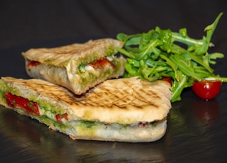 sandwich with vegetable on brown wooden table