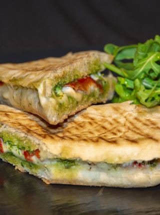 sandwich with vegetable on brown wooden table