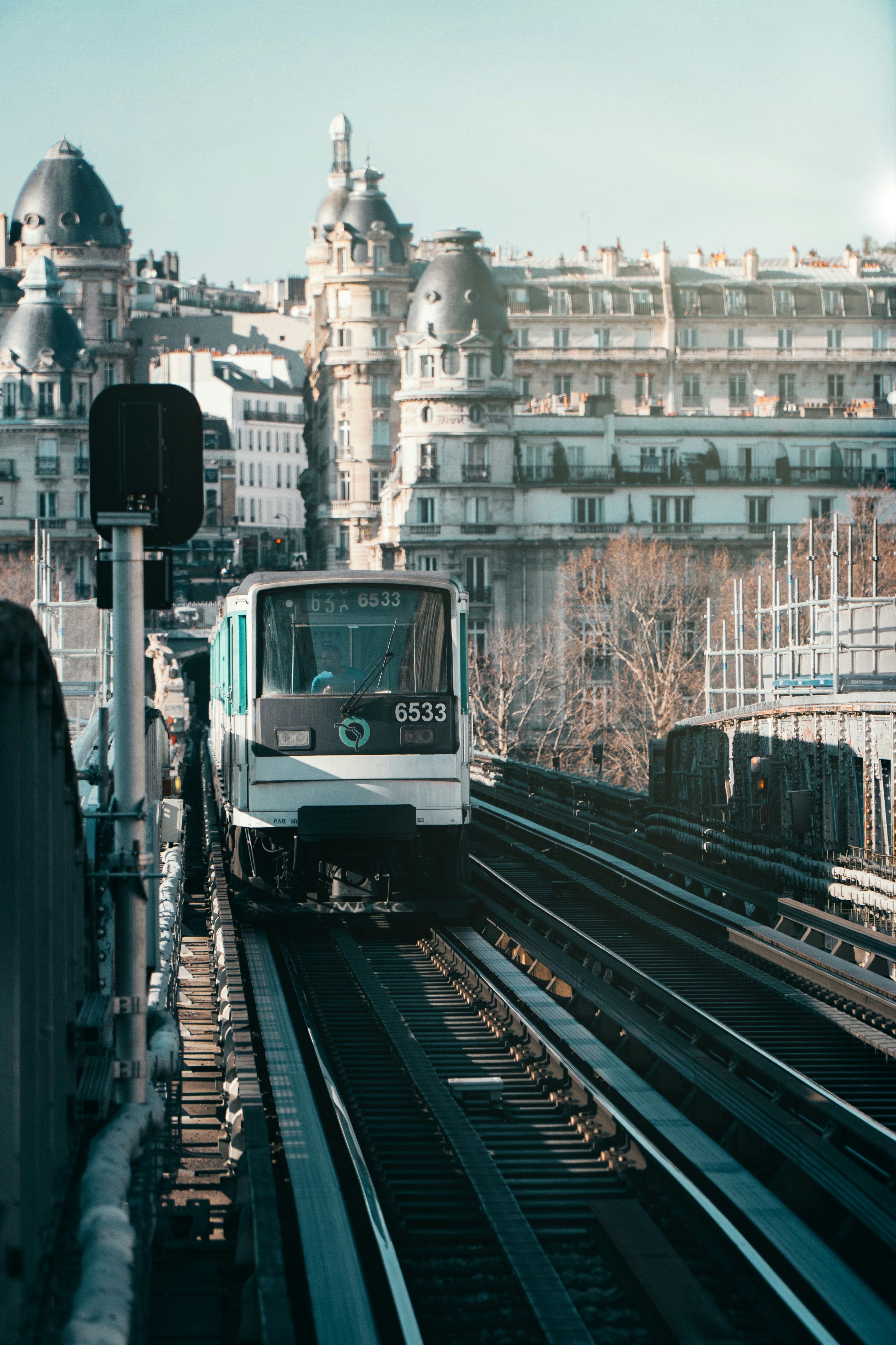 white and black train on rail road during daytime