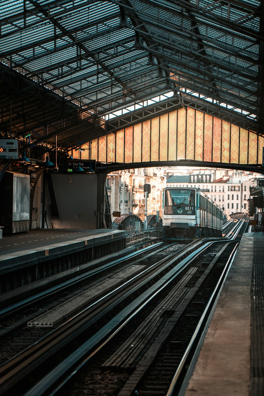 white and black train on train station during daytime