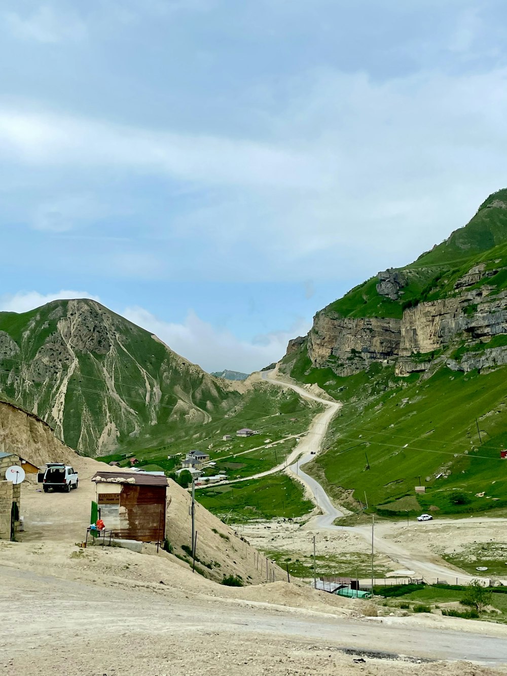 green mountains under white clouds during daytime