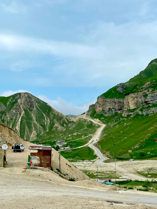 green mountains under white clouds during daytime in Laza Azerbaijan