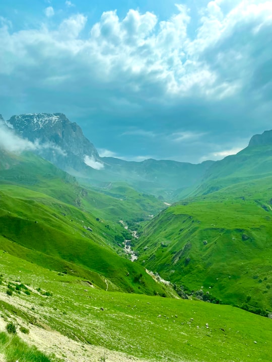 green mountains under white clouds during daytime in Laza Azerbaijan