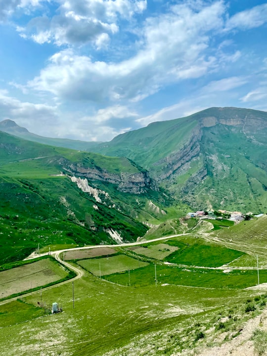 green mountains under blue sky during daytime in Laza Azerbaijan