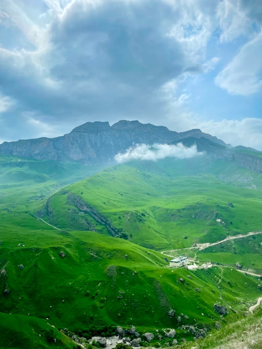 green mountains under white clouds during daytime in Laza Azerbaijan