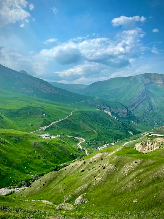 green mountains under blue sky during daytime in Laza Azerbaijan