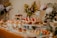 A beautifully arranged dessert table featuring elegant pastries and sweets in soft colors.