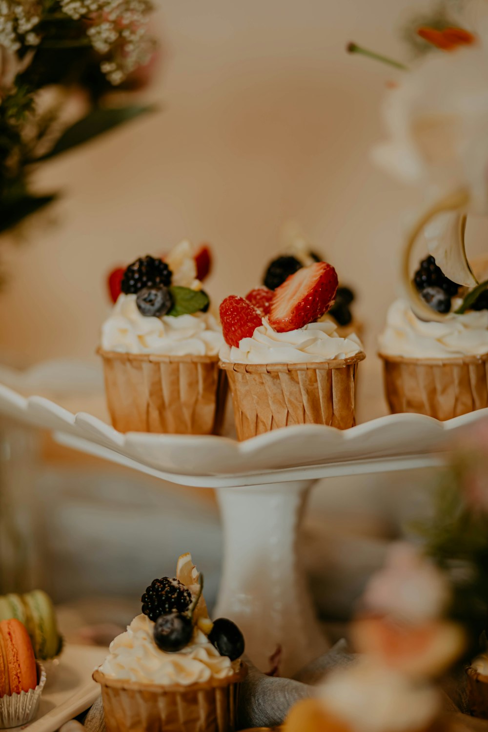 brown cupcake with strawberry on top