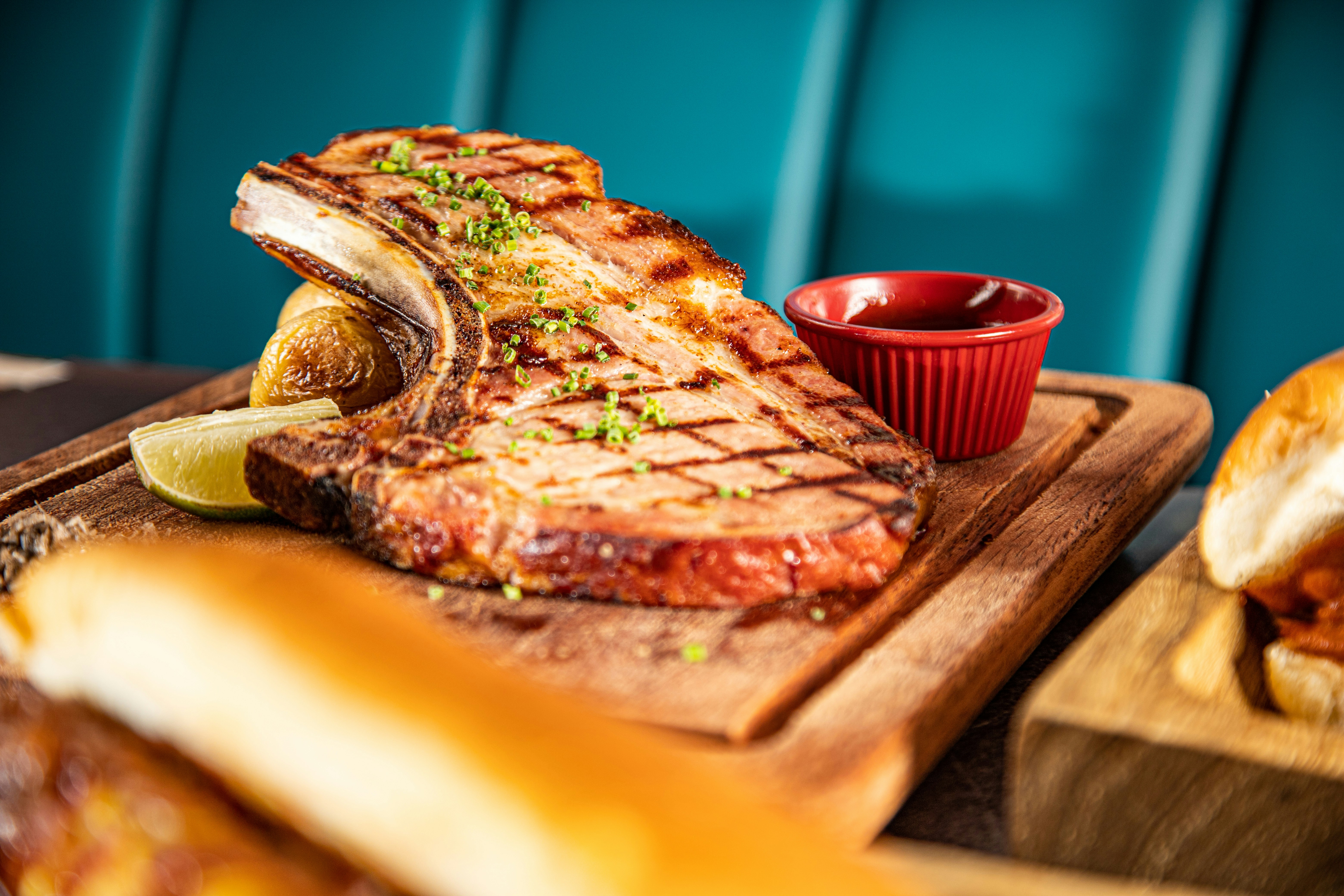 sliced pizza on brown wooden tray