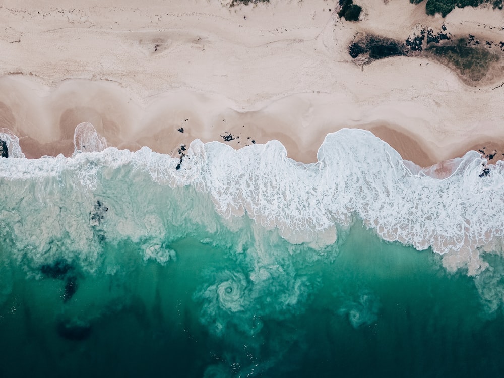 white and blue ocean waves