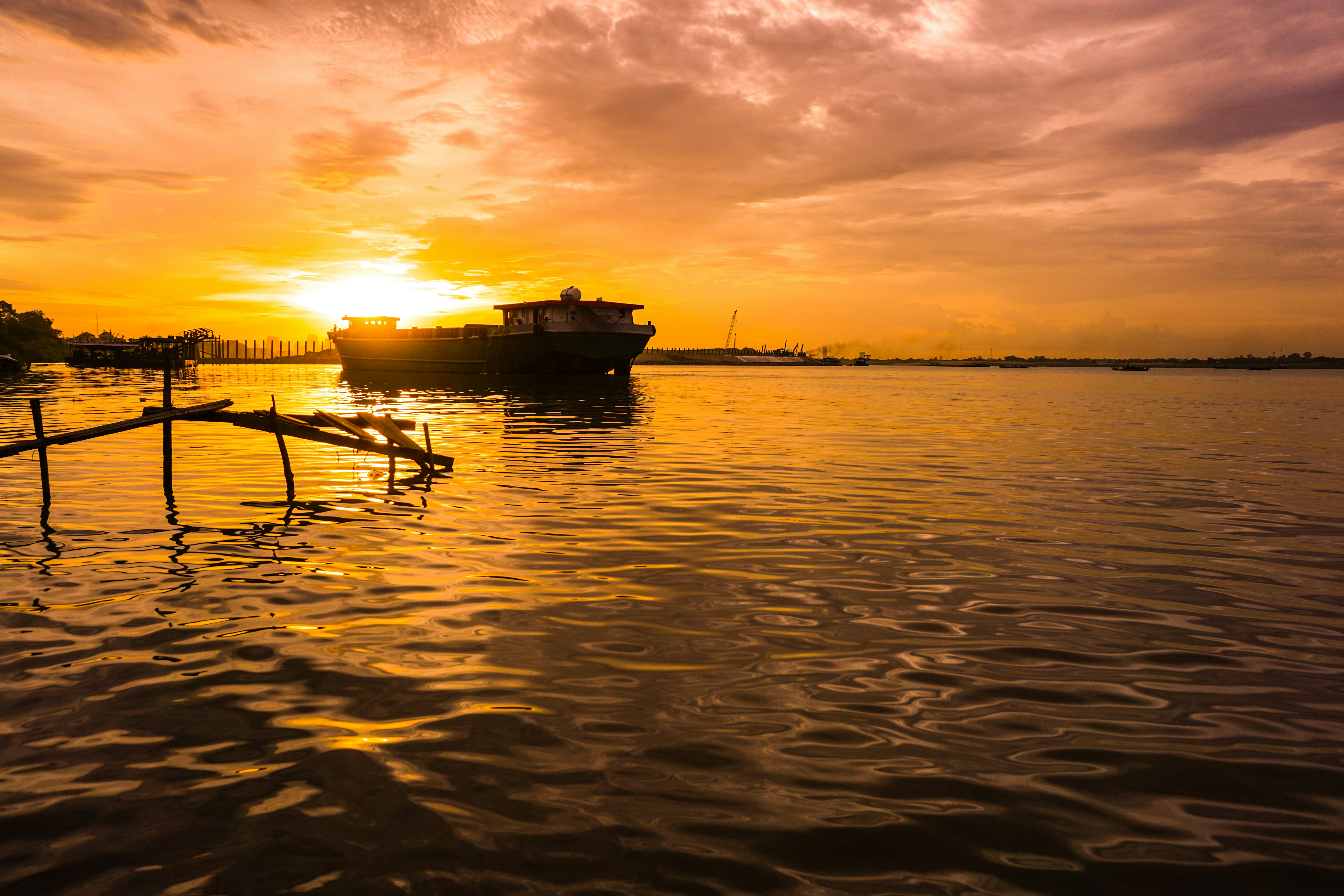 silhouette of boat on sea during sunset, 