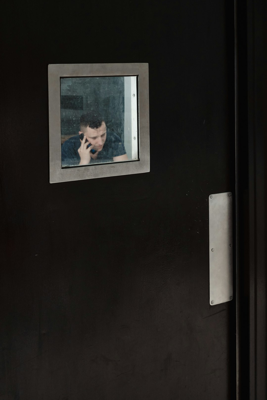 black wooden framed picture of man in black suit