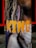 A vertical banner featuring a close-up image of a person with long dreadlocks and a gold chain around their neck. The word 'KING' is prominently displayed in bold, yellow letters across the image.