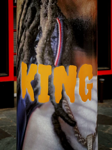 A regal purple and gold banner featuring a crown symbolizing the Kingdom Party's mission.