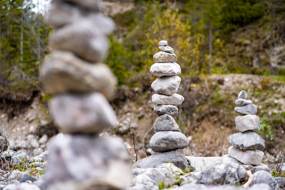 gray stone stack on green grass during daytime