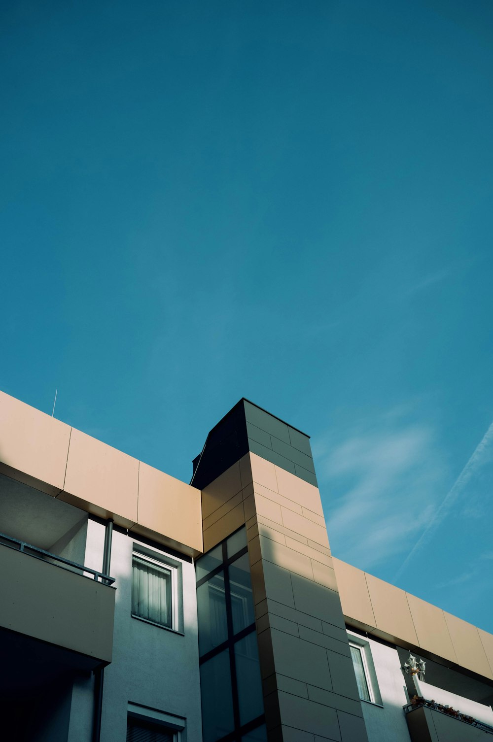 brown concrete building under blue sky during daytime