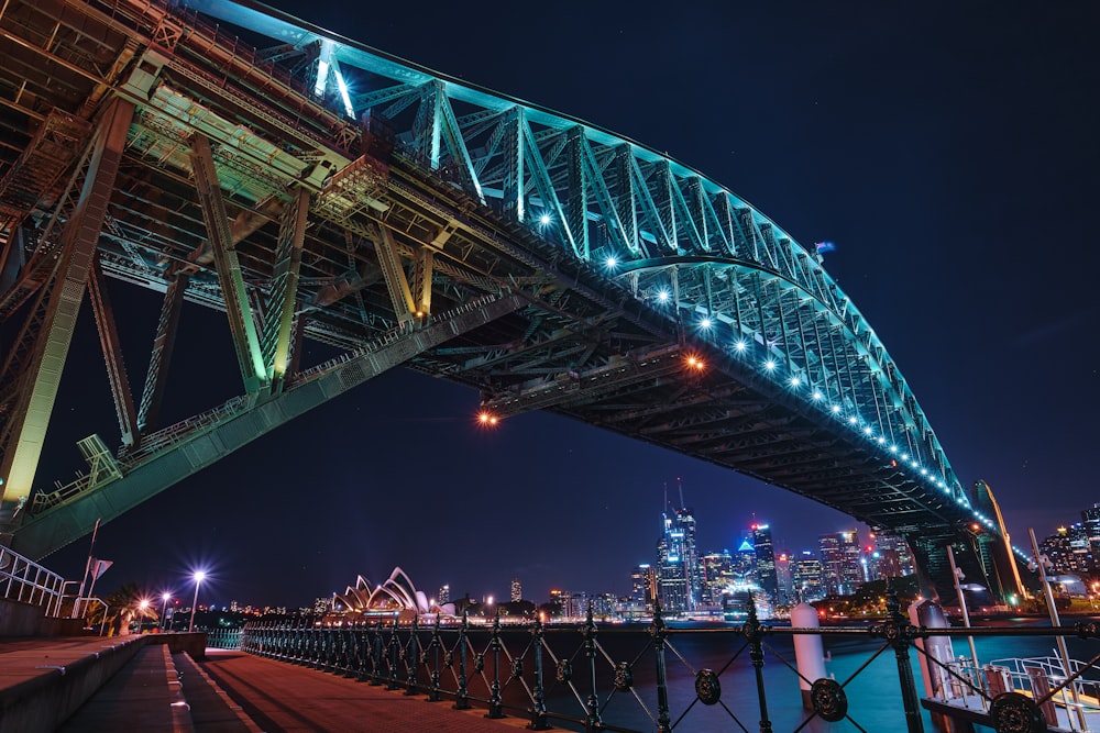 people walking on bridge during night time