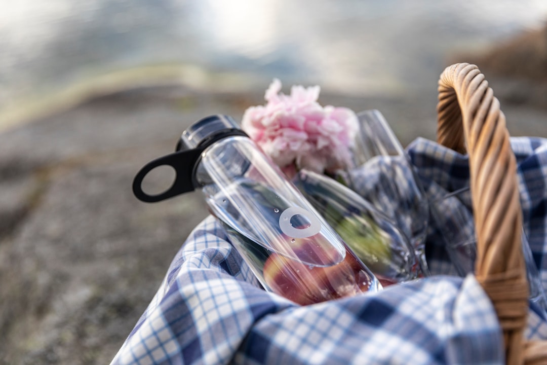 pink flower bouquet on white and blue plaid textile