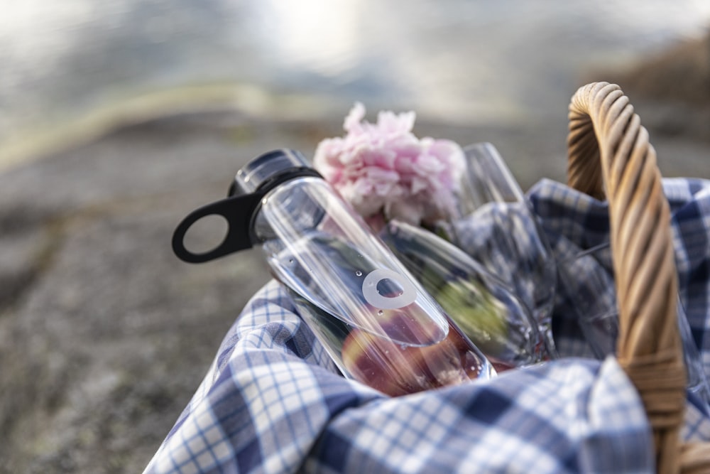 pink flower bouquet on white and blue plaid textile