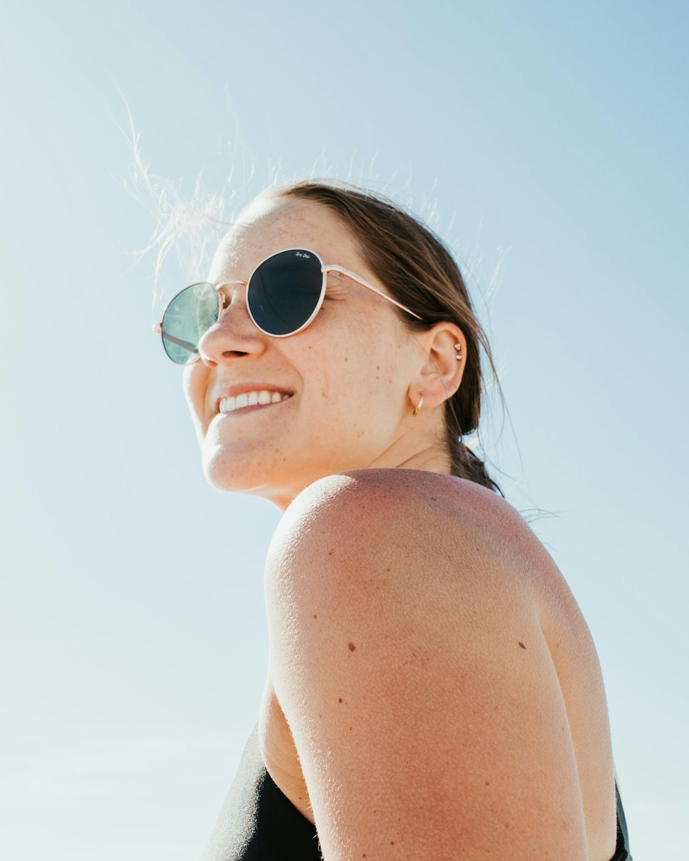 woman wearing silver framed aviator sunglasses