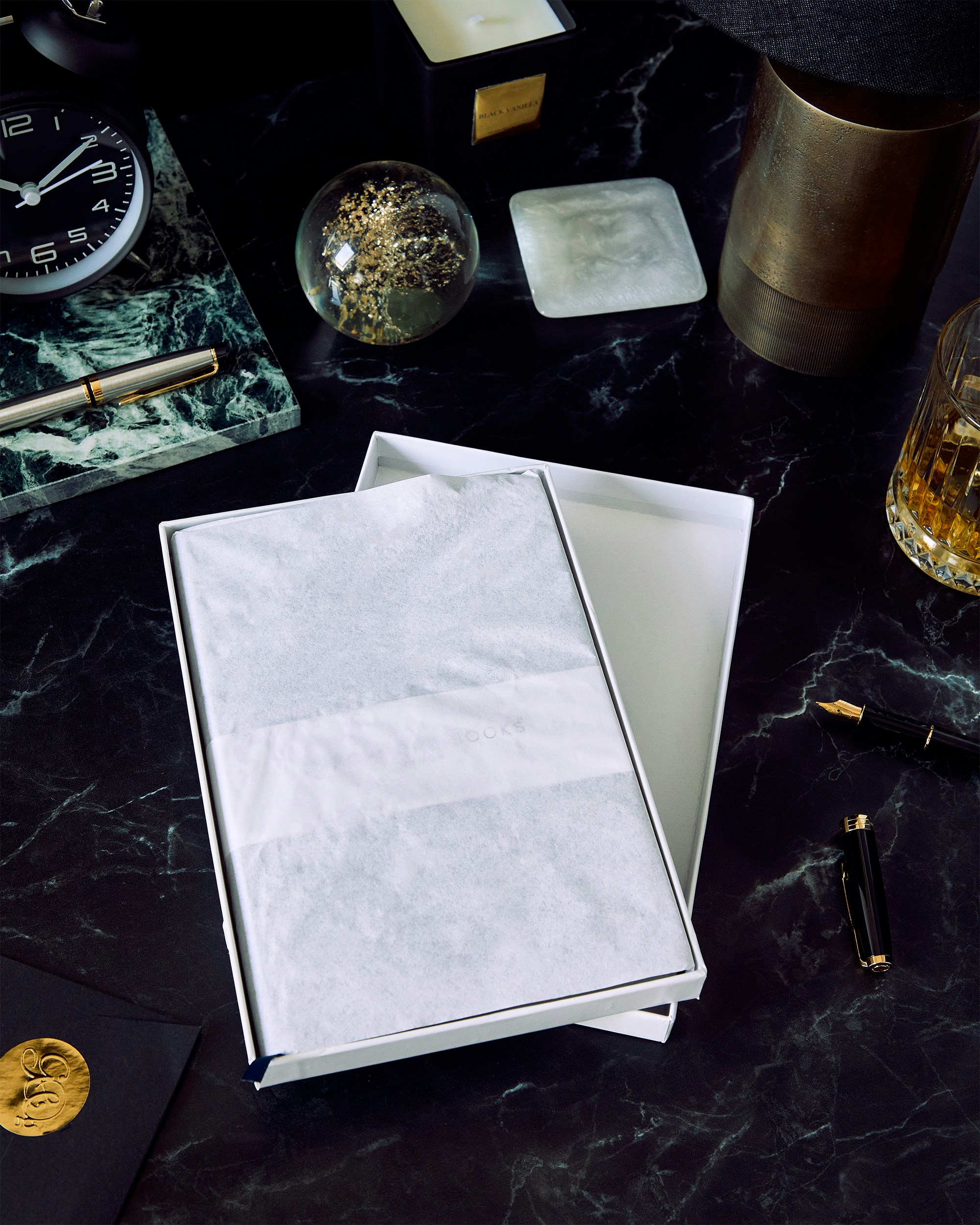 white printer paper on black table