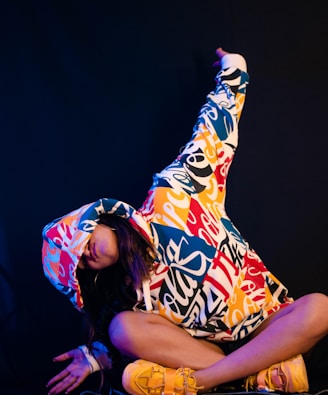 woman in yellow and red floral dress