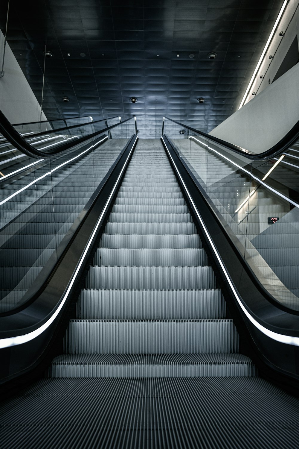 black and white escalator in a room