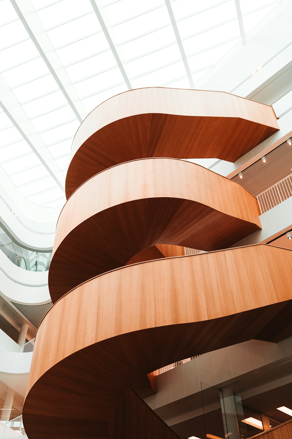 brown wooden spiral staircase inside building