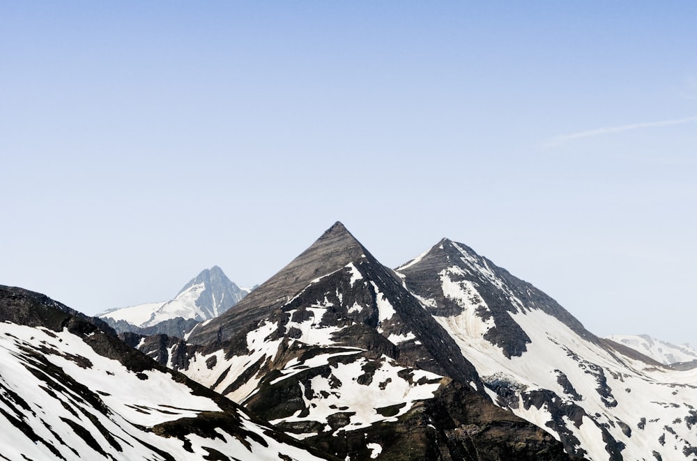 snow covered mountain under blue sky during daytime