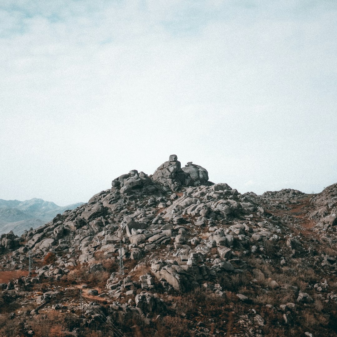 brown rocky mountain under white sky during daytime