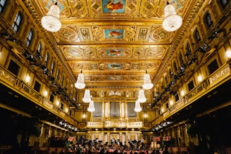 people inside building with chandeliers