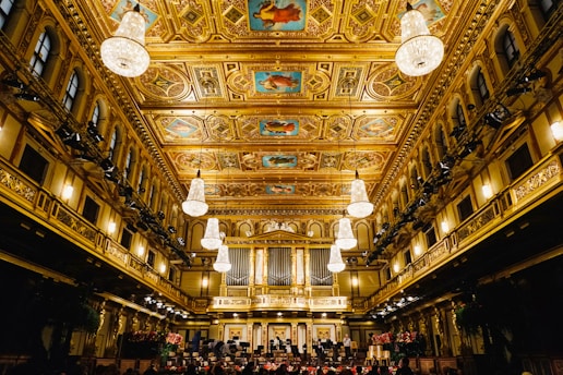people inside building with chandeliers